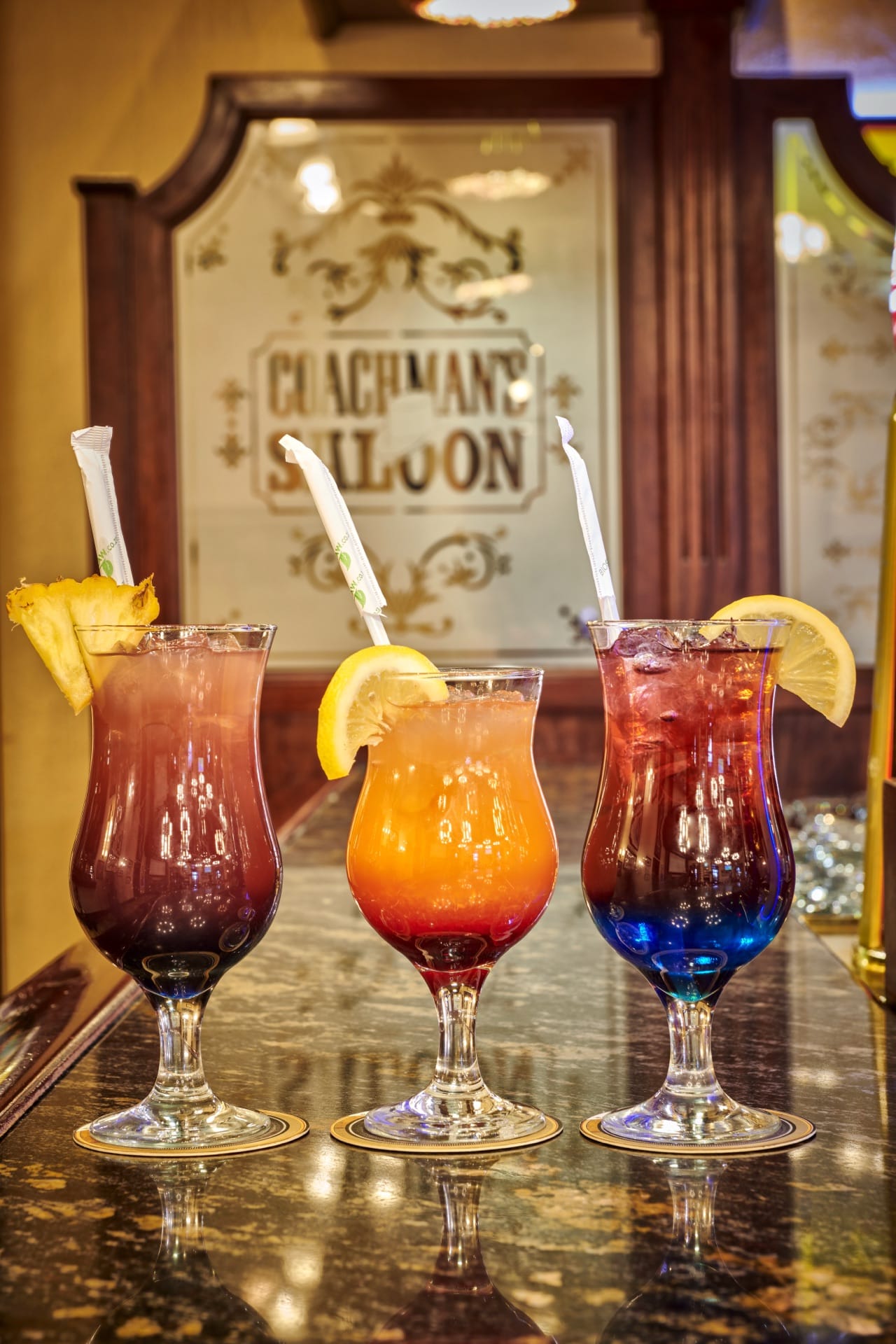 Colourful cocktails on the Coachman's Saloon bar counter at Frontier Inn, Bethlehem