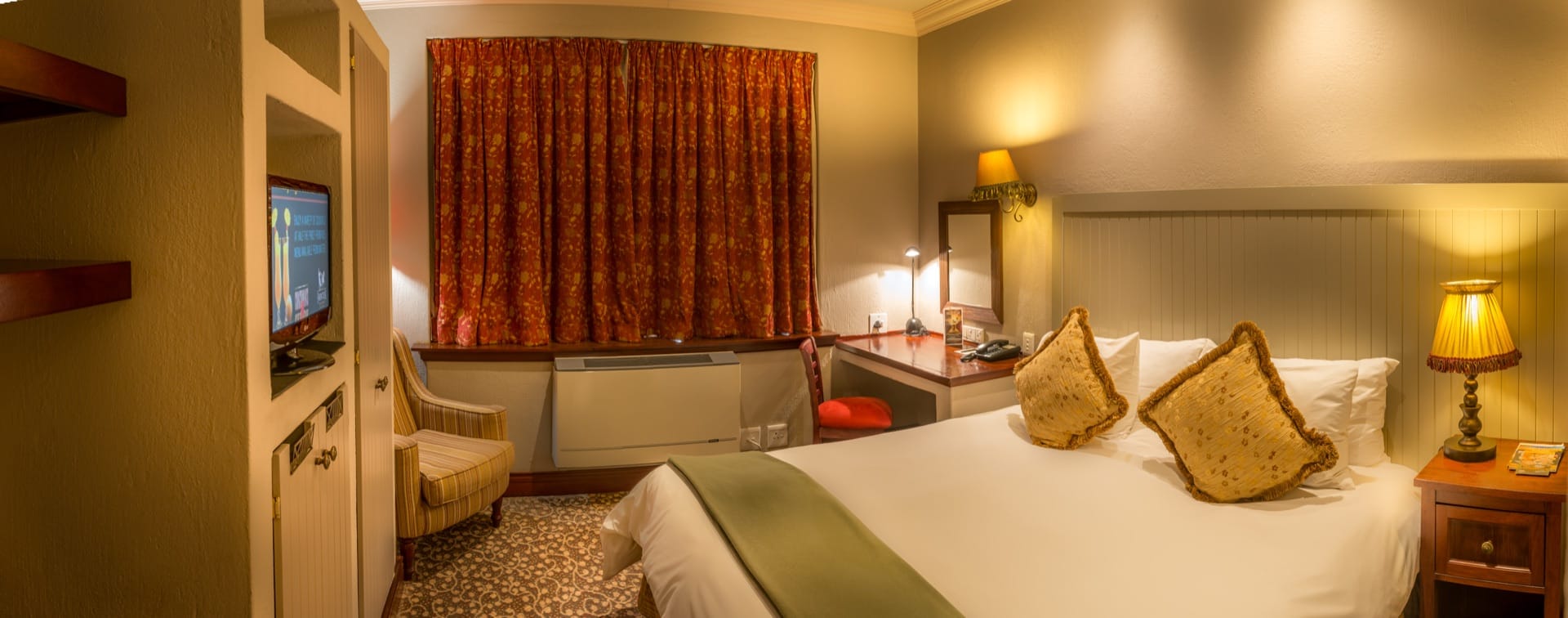Superior Twin room with made bed, desk and curtained window at Frontier Inn, Bethlehem